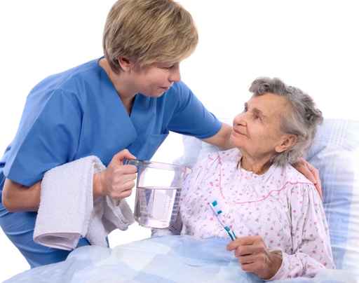 Nurse helps the senior woman in washing Nurse helps the senior woman in washing